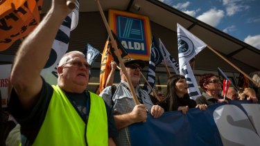 TWU members protest outside an Aldi supermarket, demanding 'safe rates' for truck drivers.