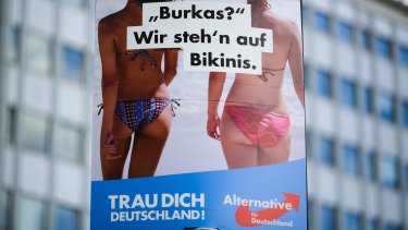 An election campaign poster of the German nationalist anti-migrant party AfD, Alternative for Germany, reading "Burkas? We like bikinis." 