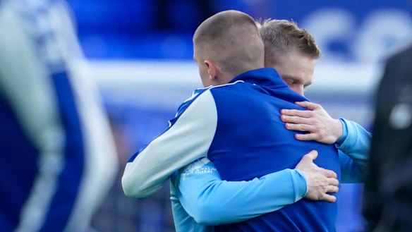 Solidarity: Manchester City’s Oleksandr Zinchenko and Everton’s Vitaliy Mykolenko embrace before their Premier League match on Saturday. 