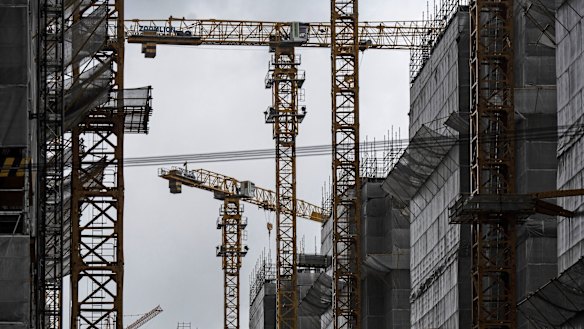Cranes at work on a residential project in Shanghai. If iron ore prices fall, chances are the Chinese economy is in trouble.