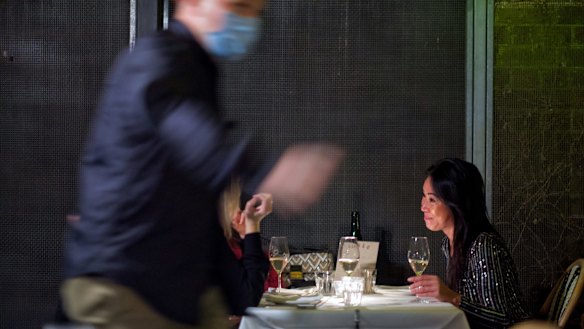 People enjoying the first hour of restaurants re-opening at The Supper Club in Melbourne.