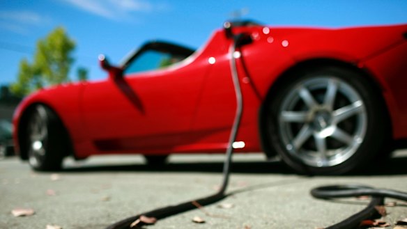 A Tesla Roadster being charged.