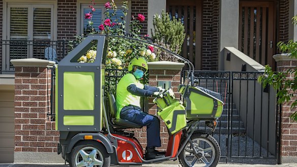 Postman Mohammed Tehseen on his route delivering parcels early in the pandemic. 