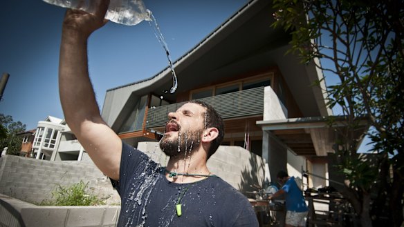 Carpenter Buddy Kirner tries to keep cool in the Brisbane heat.