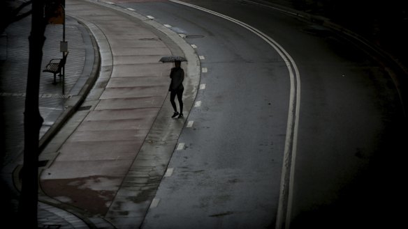 Umbrellas come out on the streets of Bondi Junction as light rain falls in Sydney.