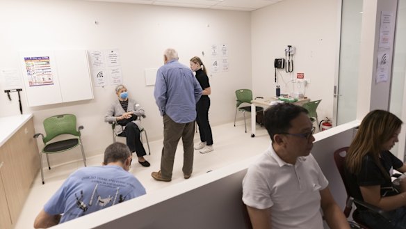 Patients sit in a waiting area after receiving the COVID-19 AstraZeneca vaccine at the Sydney West COVID vaccination centre in Olympic Park on April 6.