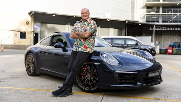 Paul with his Porsche that he allows 
a player to drive as a reward for a good game.