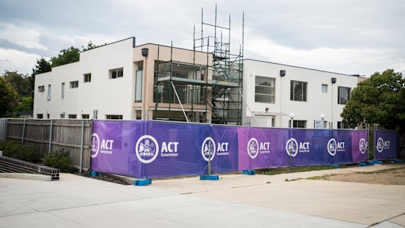 The Braddon public housing has sat empty for three years because of a dispute between the government and builder. 