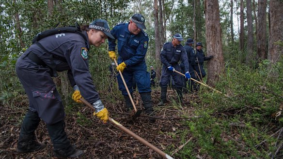 Police conduct a forensic search in bushlands at Kendall in June 2018.
