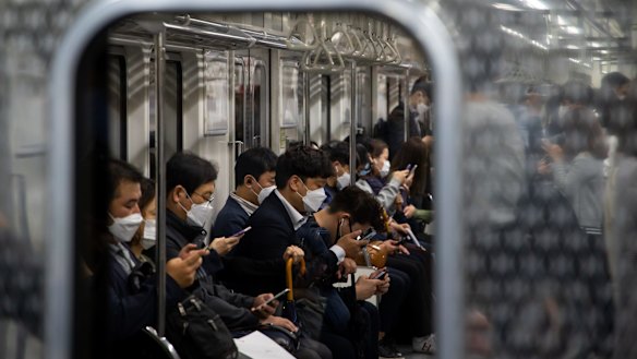 Passengers on a subway train in Seoul last week.