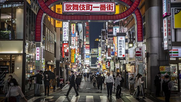 People wearing face masks in the Kabuki-cho area of Tokyo.