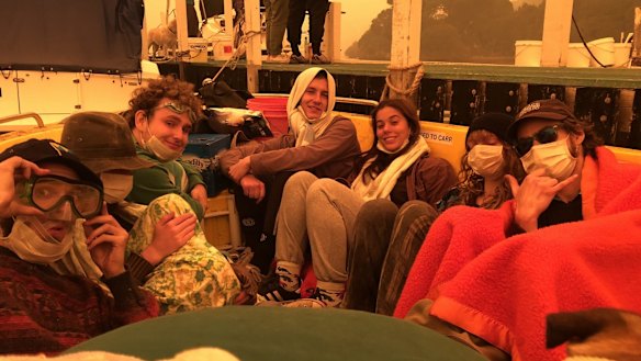 Mary O'Malley and Larry Gray are taking shelter in a borrowed boat at Mallacoota.