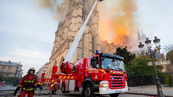 Fire fighters working at the burning Notre-Dame cathedral.