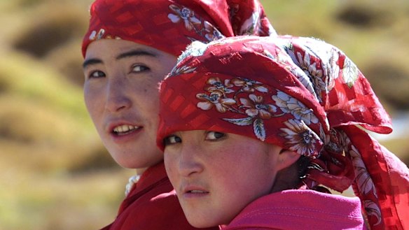 Two ethnic Kyrgyz women in the Karakorum mountain range in China's western Xinjiang province. The area, close to China's borders with Afghanistan, Pakistan and Tajikistan, is populated by a variety of ethnic groups. 