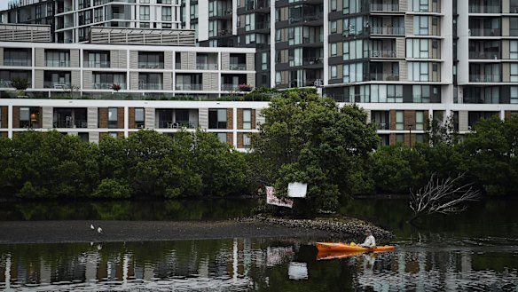 A kayaker paddles past Fatima Island at Tempe.