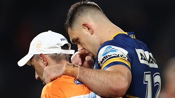 Ryan Matterson is helped off the field after a first-half concussion against the Tigers on Thursday night.