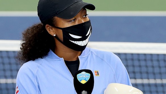 Naomi Osaka speaks during the trophy ceremony.