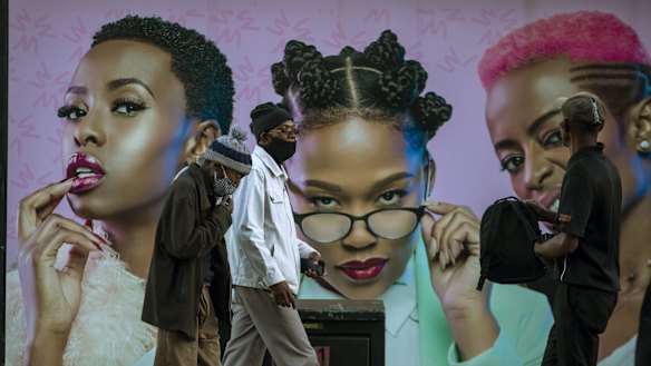 Men wearing masks in Soweto, South Africa. The continent is experiencing a surge in infections.