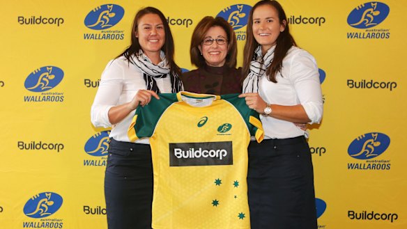 Josephine Sukkar with Wallaroos Sharni Williams and Shannon Parry. 