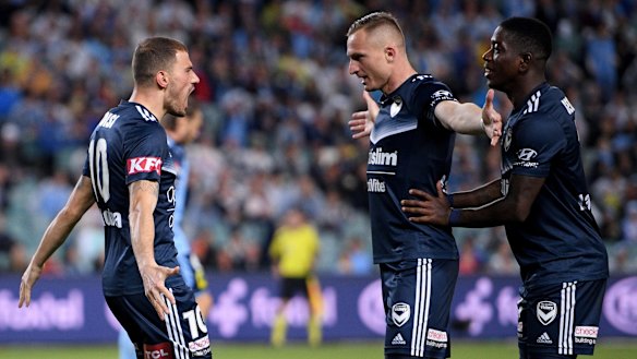 James Troisi (left) celebrates with team mates after putting Victory 2-1 ahead.