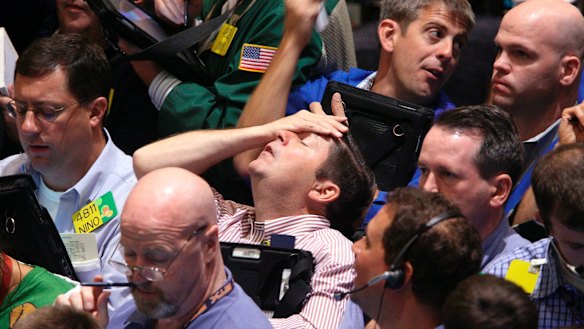 Wall St traders in September 2008. After the global financial crisis, central banks around the world introduced quantitative easing programs.