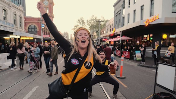 Richmond supporters on Swan Street celebrating their team’s win over Adelaide during the 2017 grand final. 