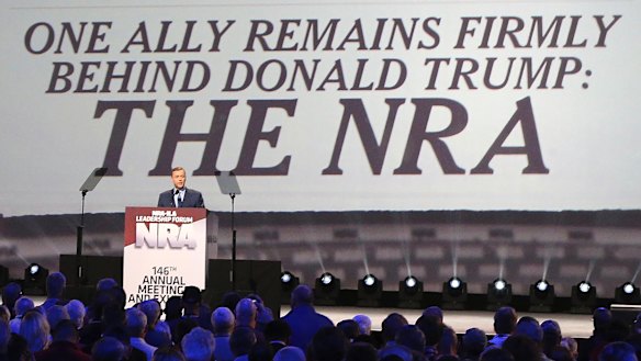 Strong ties: NRA's Chris Cox introduces President Donald Trump at the a Leadership Forum last year.