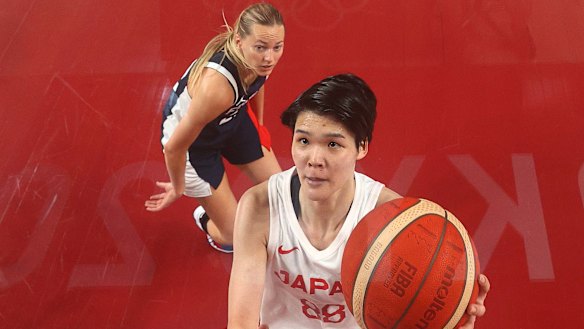 Himawari Akaho #88 of Team Japan drives to the basket against Marine Johannes #23 of Team France.