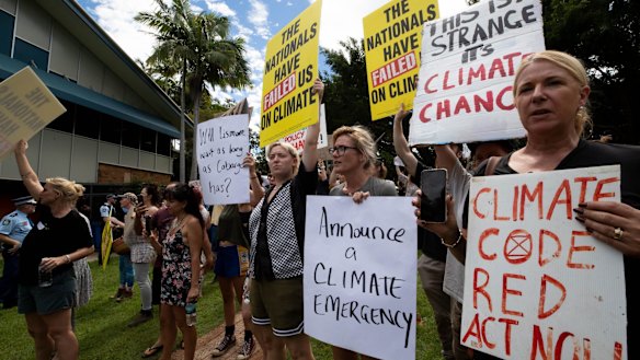Protesters at Lismore Council Chambers wait for the Prime Minister Scott Morrison on March 9.