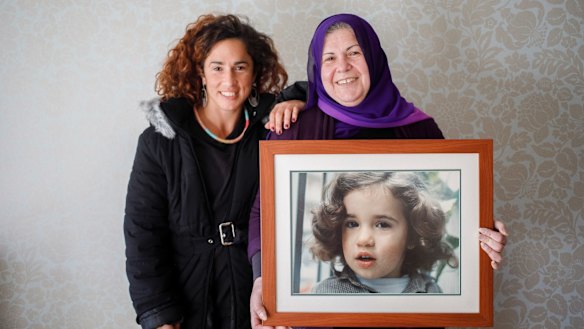 Bianca Elmir with her mother Diana Abdel-Rahman holding photo of her as a child.