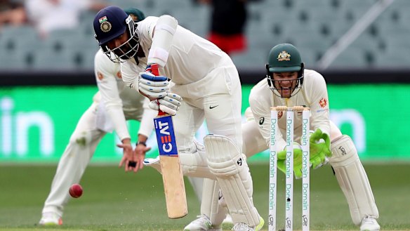 Dead bat: Cheteshwar Pujara met the challenge of Nathan Lyon with patient determination.