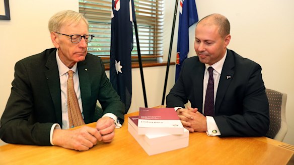 Commissioner Kenneth Hayne and Treasurer Josh Frydenberg, right, with the final report from the Royal Commission into misconduct in the Banking, Superannuation and Financial Services Industry.