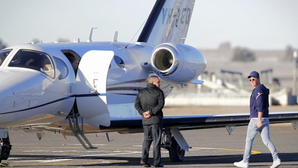Oliver Curtis boards a plane after departing the Cooma Correctional Centre in 2017.