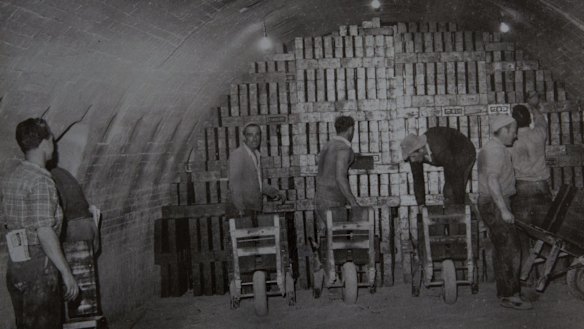 Workers stack bricks by hand in the Staffordshire kiln.