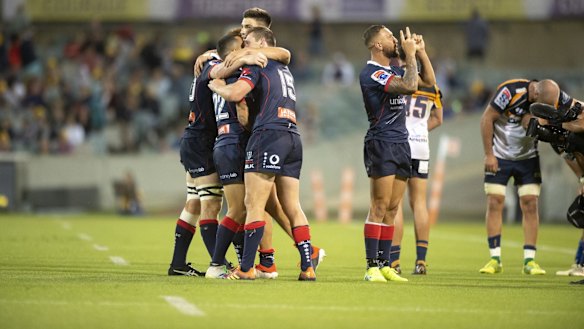 Quade Cooper gestures to the crowd.