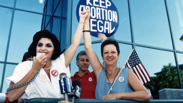 Attorney Gloria Allred and Norma McCorvey, right, at a pro-choice rally in 1989. 