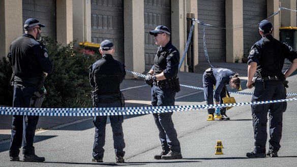 Police investigating at the scene of the alleged murder.