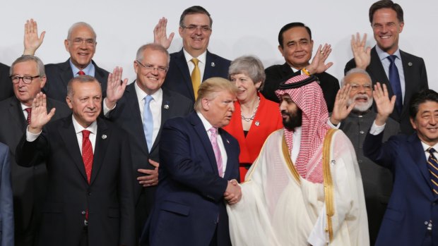 Prime Minister Scott Morrison with US President Donald Trump and world leaders, including Britain's Theresa May and Saudi Arabia's Crown Prince Mohammed bin Salman, in the "family photo" at the G20 Summit in Osaka. 