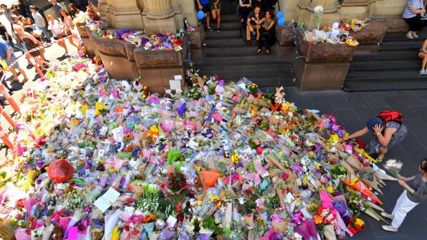 The huge pile of flowers in Bourke Street in the aftermath of the tragedy.