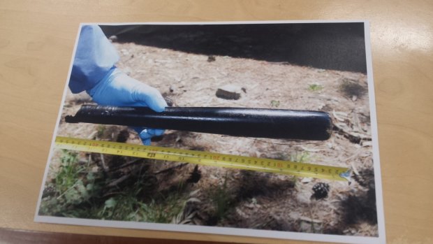 A police photo of a snapped baseball bat allegedly used to bash Mark Spencer.