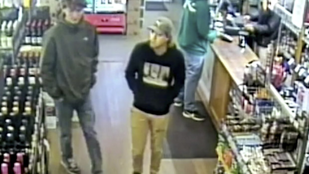 Missing Belgian backpacker Theo Hayez, center, wearing black hooded jumper, inside liquor store in Byron Bay.