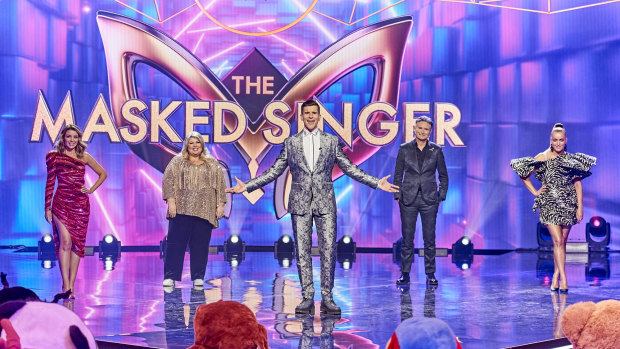 The Masked Singer's host,  Osher Gunsberg (centre), with this year's guessing panel, including Dave Hughes.
