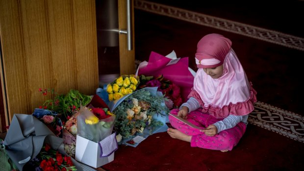 Flowers left at the Gungahlin mosque the day after the mass shootings at mosques in Christchurch.