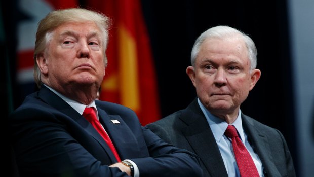 President Donald Trump sits with Attorney-General Jeff Sessions during the FBI National Academy graduation ceremony in Quantico, Virginia, in December. 