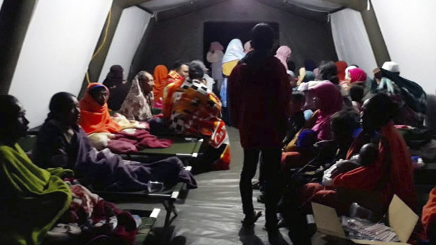 People affected by the earthquake rest at a temporary shelter in Lombok, Indonesia.