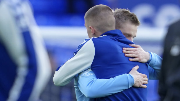 Solidarity: Manchester City’s Oleksandr Zinchenko and Everton’s Vitaliy Mykolenko embrace before their Premier League match on Saturday. 