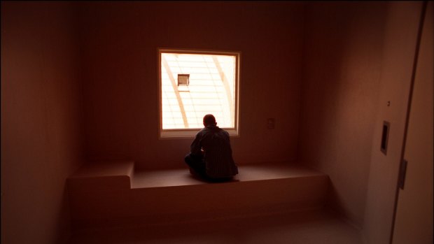 A patient in a seclusion room.