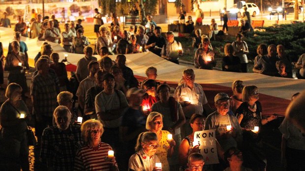 Hundreds of Warsaw residents hold another day of protests against changes that the ruling conservative party is introducing to the justice system, in Warsaw, last Friday.