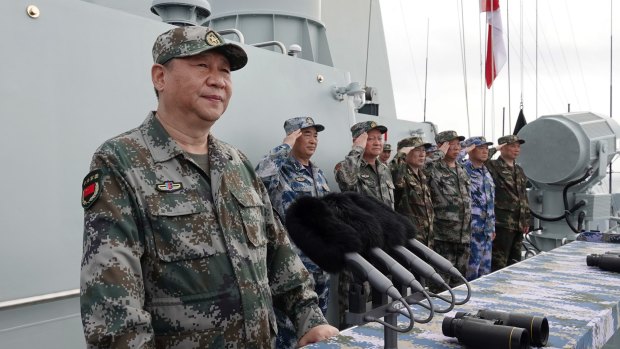 Flexing his muscles in the region. Xi Jinping speaks after reviewing the Chinese People's Liberation Army Navy fleet in the South China Sea in 2018.