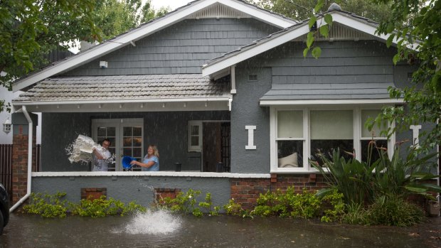 Residents with flooded property in Elwood following a storm in 2016.